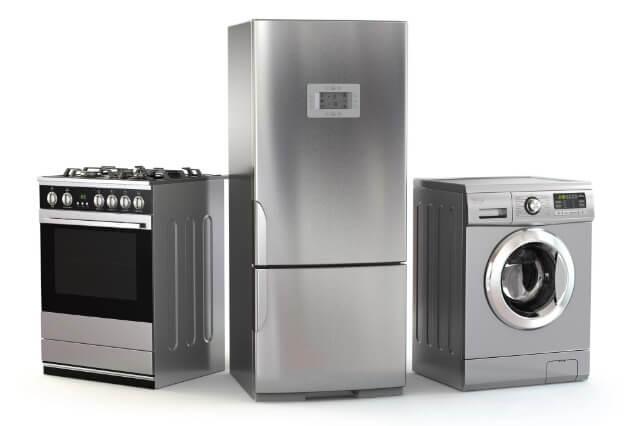an appliance technician servicing a faulty microwave